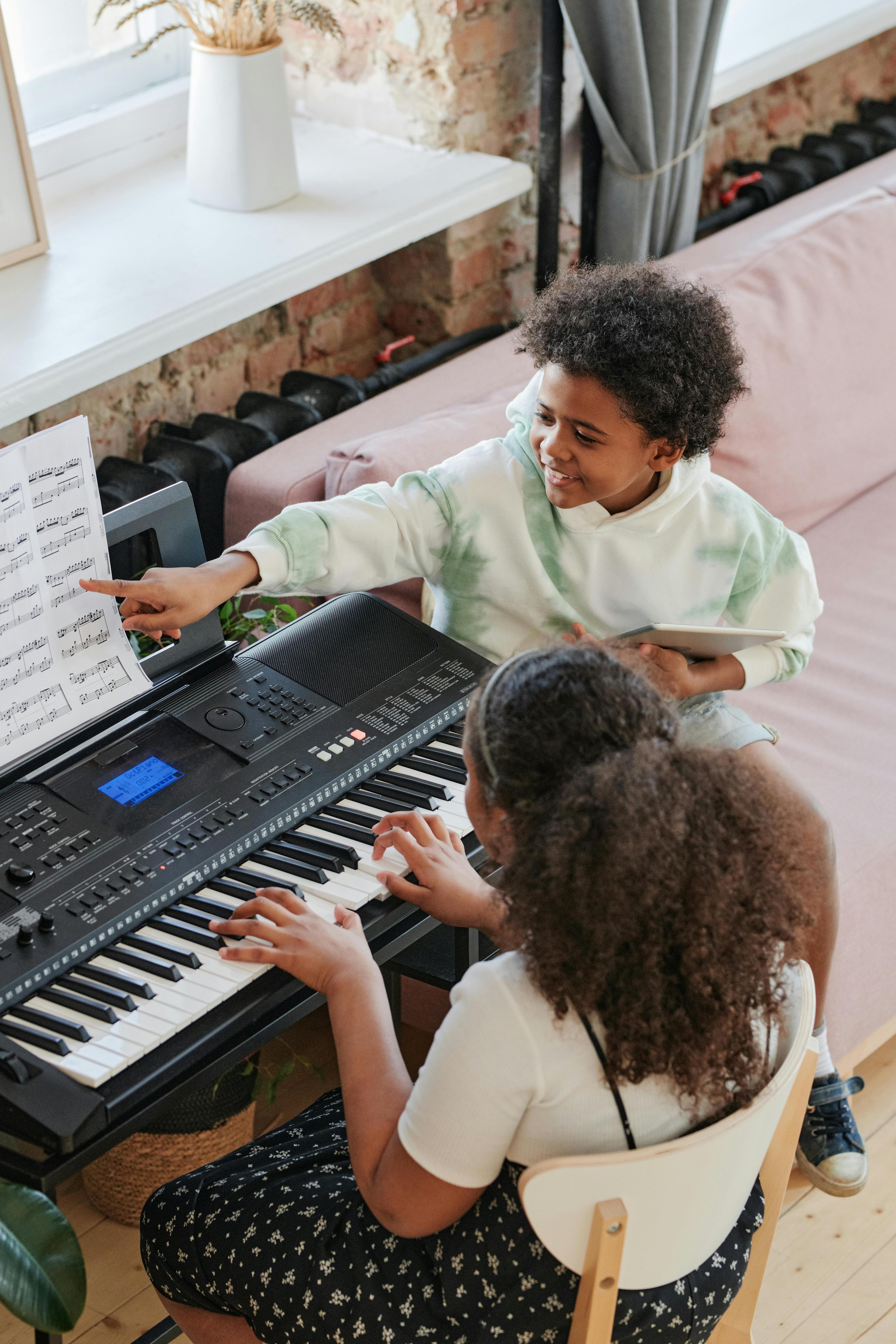 Teenager playing an electronic keyboard